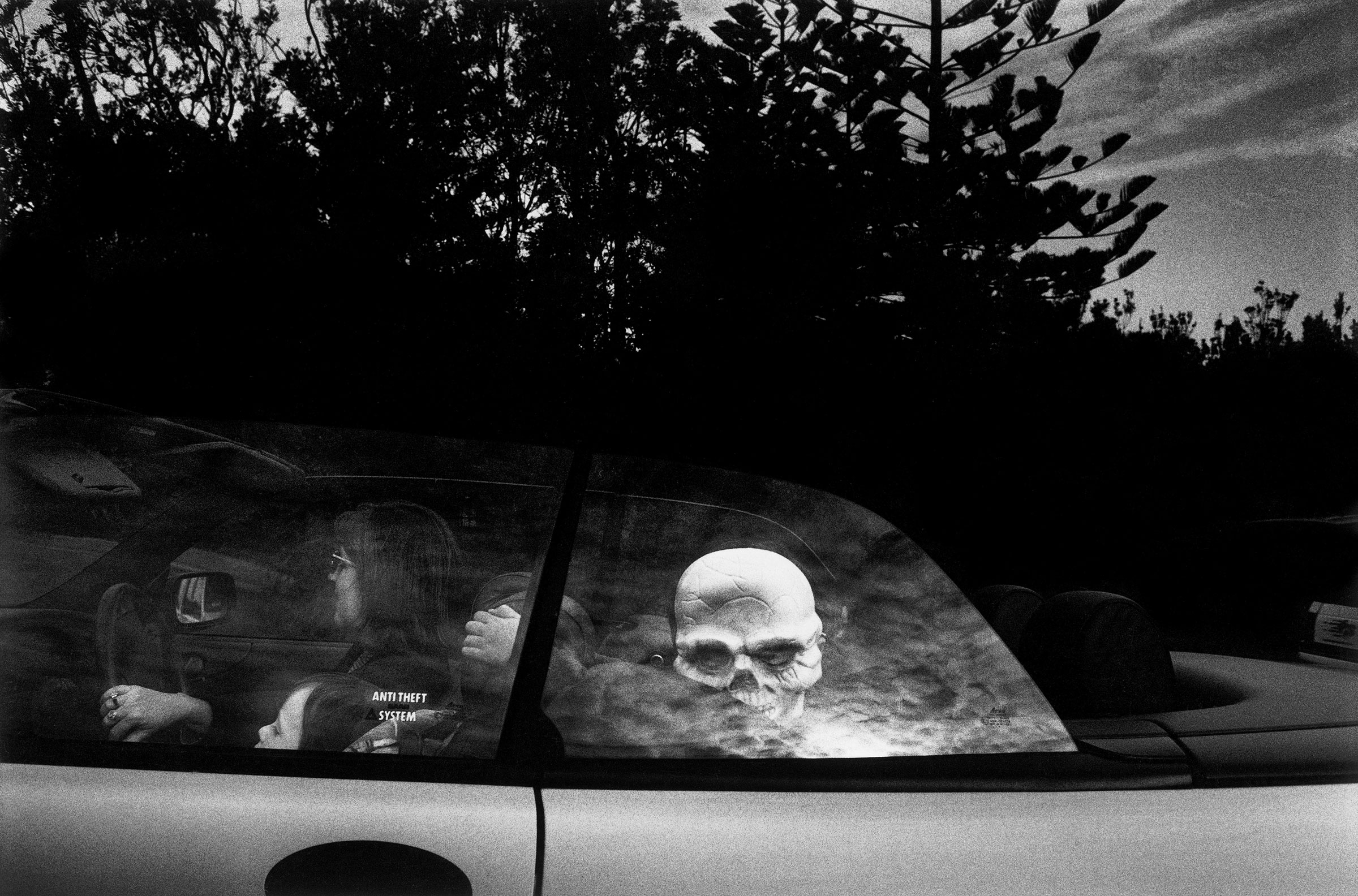 A child with a skeleton mask arrives at a fancy dress party in Watsons Bay, Sydney, Australia in 1998. (Trent Parke—Magnum Photos)