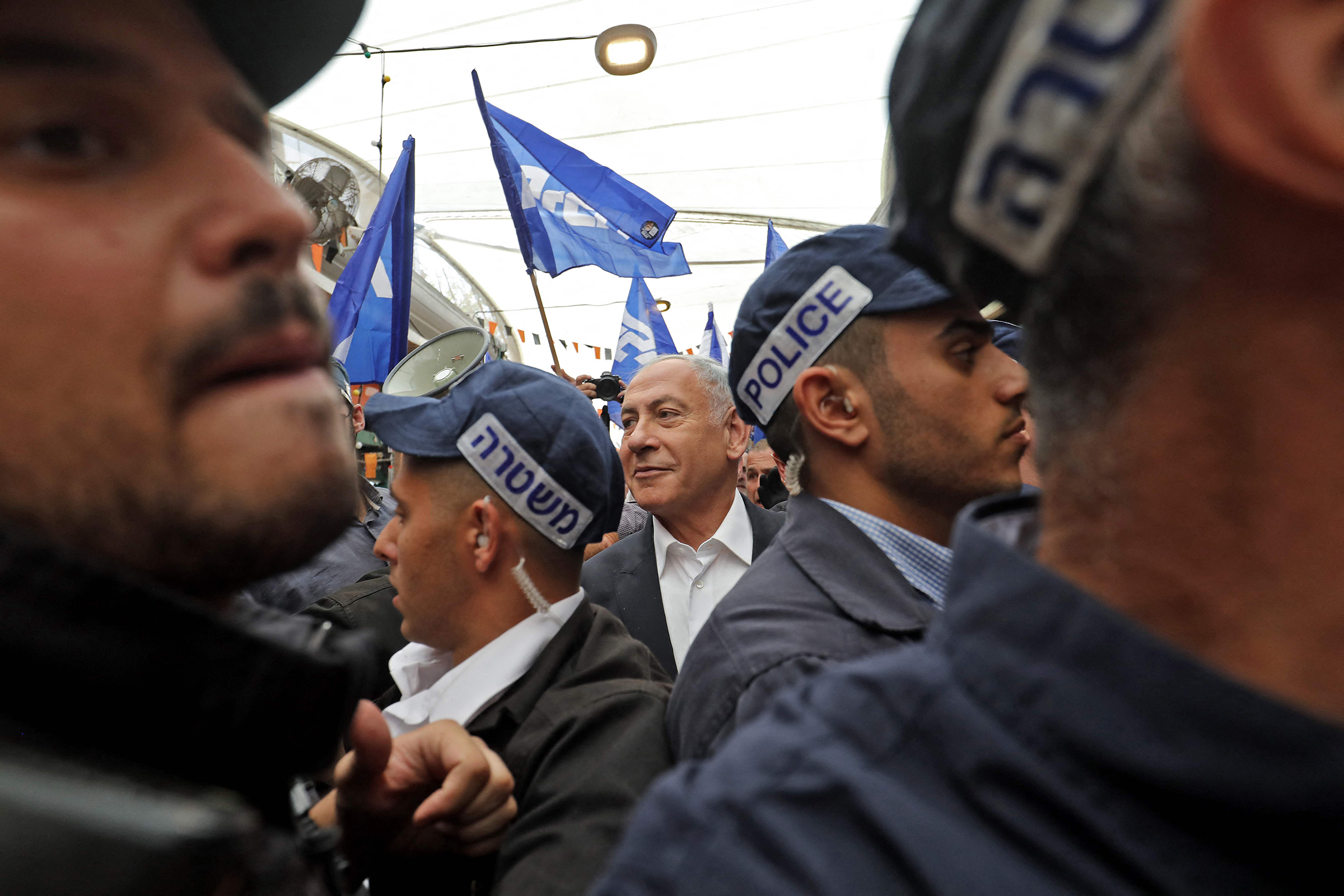 Former Israeli Prime Minister Benjamin Netanyahu visits the Tikva market in Tel Aviv on Oct. 28 ahead of the November general elections. (Gil Cohen-Magen—AFP/Getty Images)