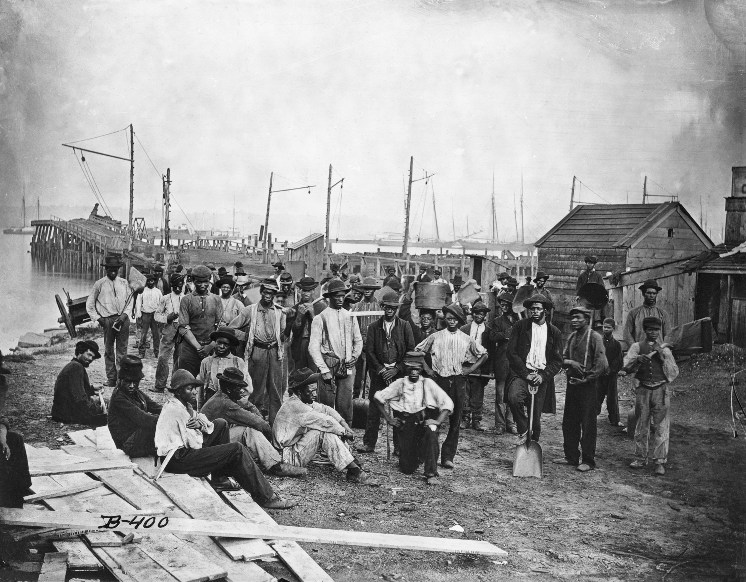 A group of freed African American slaves along a wharf during the United States Civil War.