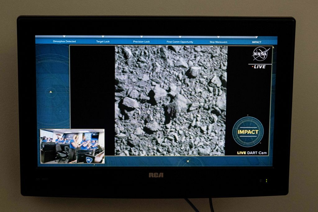 A television at NASA's Kennedy Space Center in Cape Canaveral, Florida, captures the final images from the Double Asteroid Redirection Test (DART) as it smashes into the asteroid Dimorphos on Sept. 26, 2022. (JIM WATSON/AFP—Getty Images)