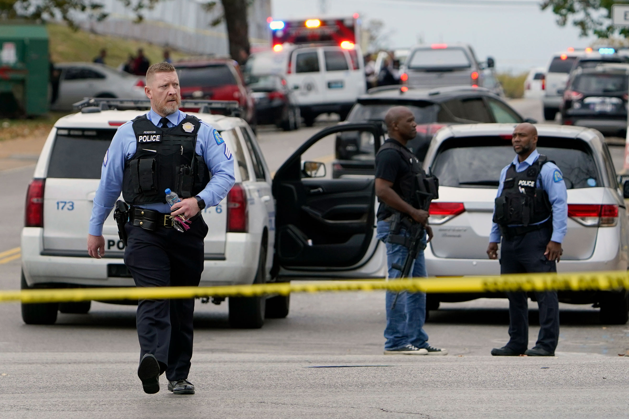 Law enforcement investigate the scene of a shooting at Central Visual and Performing Arts High School in St. Louis, on Monday, Oct. 24, 2022.