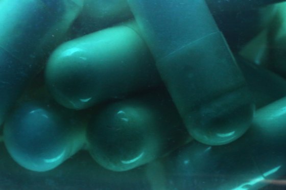 Full frame of capsule pills in a bottle