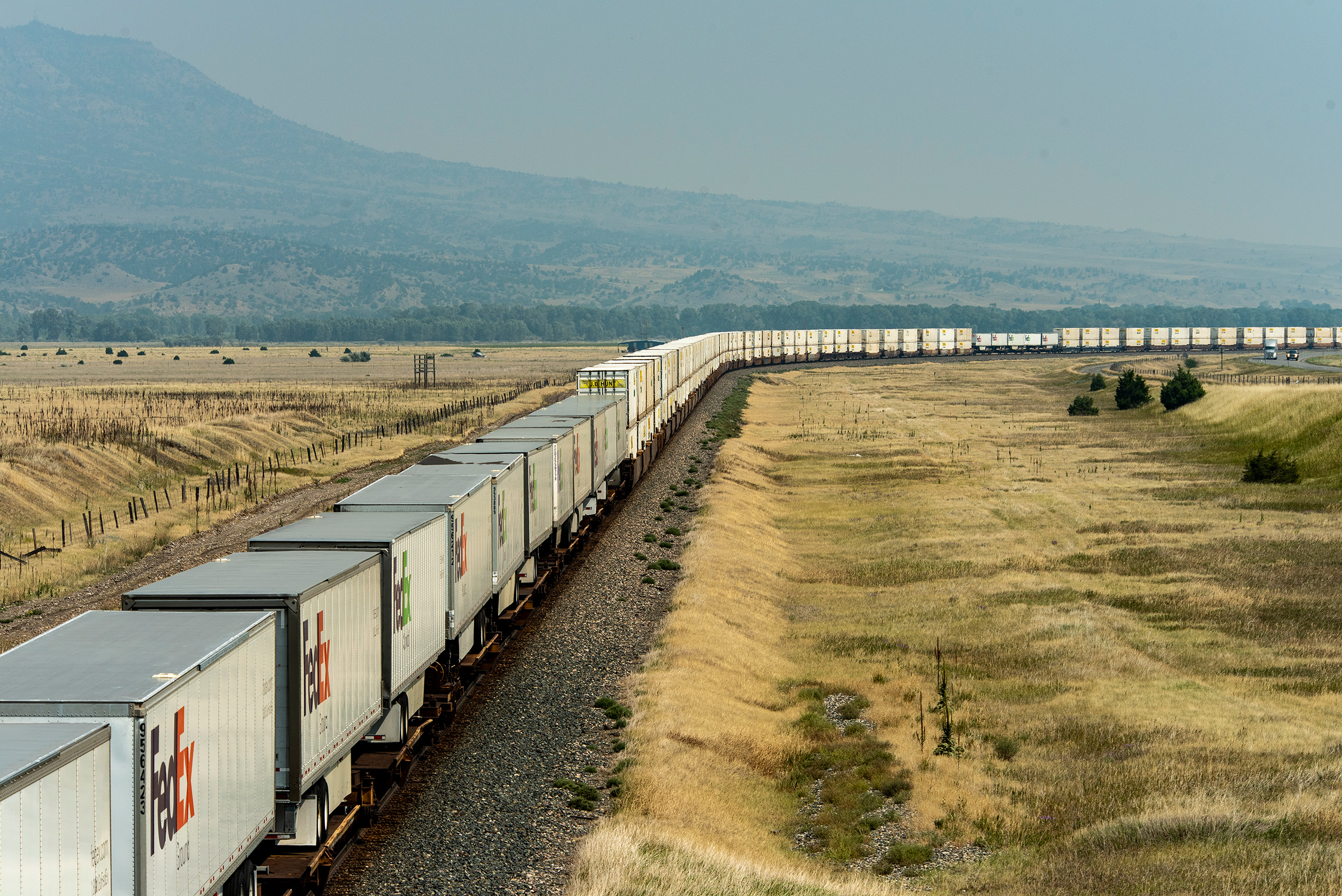 A BNSF freight train with 76 container cars and FedEx freight trailers travels from Seattle to points east on August 23, 2021 in Livingston, Mont. (William Campbell—Getty Images)