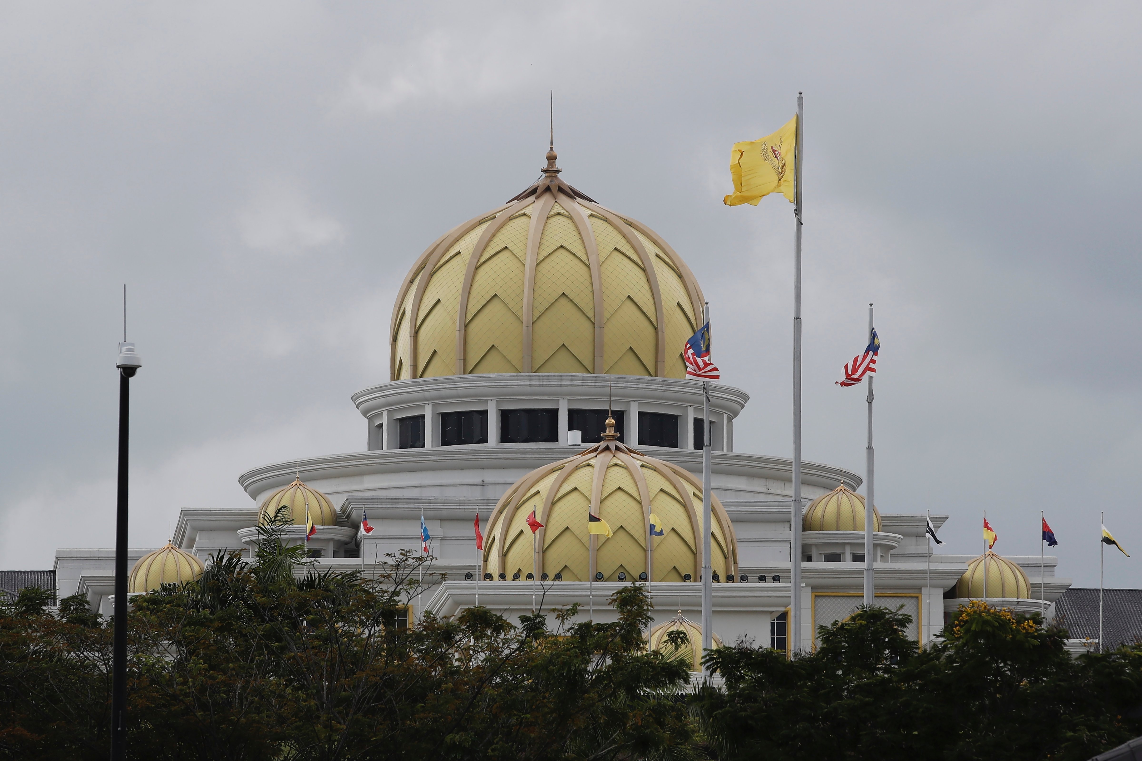 Flags fly outside the National Palace in Kuala Lumpur, Nov. 22, 2022. Malaysia’s election uncertainty deepens as the king has failed to reach a decision on whom to pick as prime minister, several days after divisive polls produced no outright winner. (FL Wong—AP)