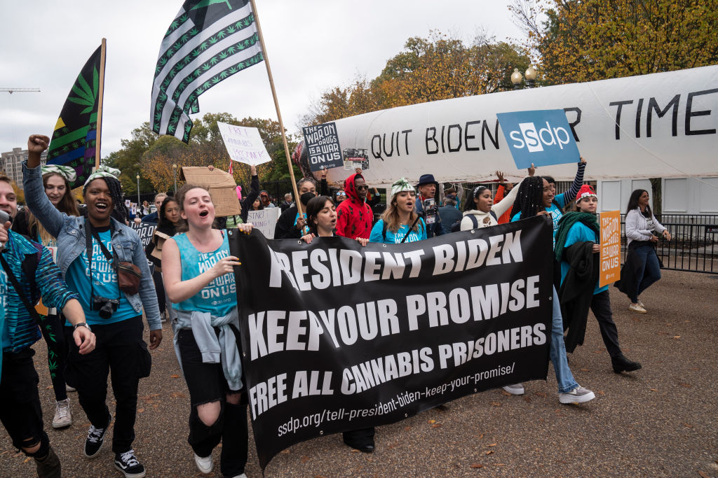 Protesters gather in front of the White House to demand the release of all people incarcerated for cannabis-related offenses on Oct. 24, 2022 in Washington, DC. President Biden made an announcement that he wanted to release those incarcerated and decriminalize marijuana, but no prisoners as of now have been released. (Michael Robinson Chavez—The Washington Post/ Getty Images)