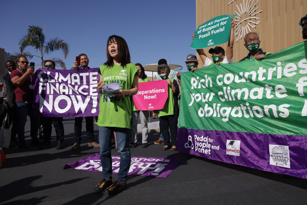 Activists demanding climate finance and debt relief for countries exposed to the effects of climate change protest during an impromptu demonstration during the COP27 climate conference on November 9, 2022 in Sharm el-Sheikh, Egypt.  (Sean Gallup—Getty Images)