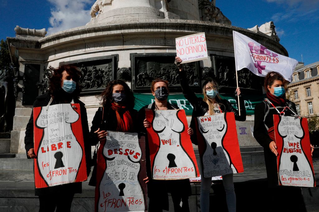 Members of the feminist association "Les Effronte-E-S" hold posters with drawings of women bodies during a gathering to defend the right to abortion in Paris, on Sept. 26, 2020. (Geoffroy Van der Hasselt—AFP via Getty Images)