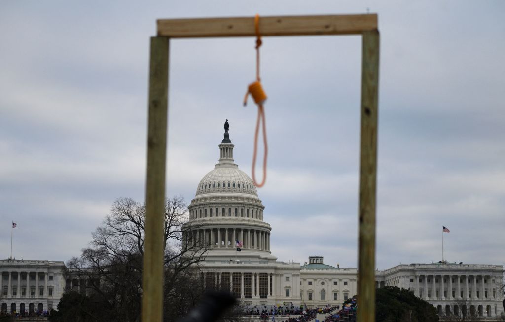 A noose is seen on makeshift gallows as supporters of US President Donald Trump gather on the West side of the US Capitol in Washington DC on January 6, 2021. - Donald Trump's supporters stormed a session of Congress held today, January 6, to certify Joe Biden's election win, triggering unprecedented chaos and violence (Andrew CABALLERO-REYNOLDS-AFP)
