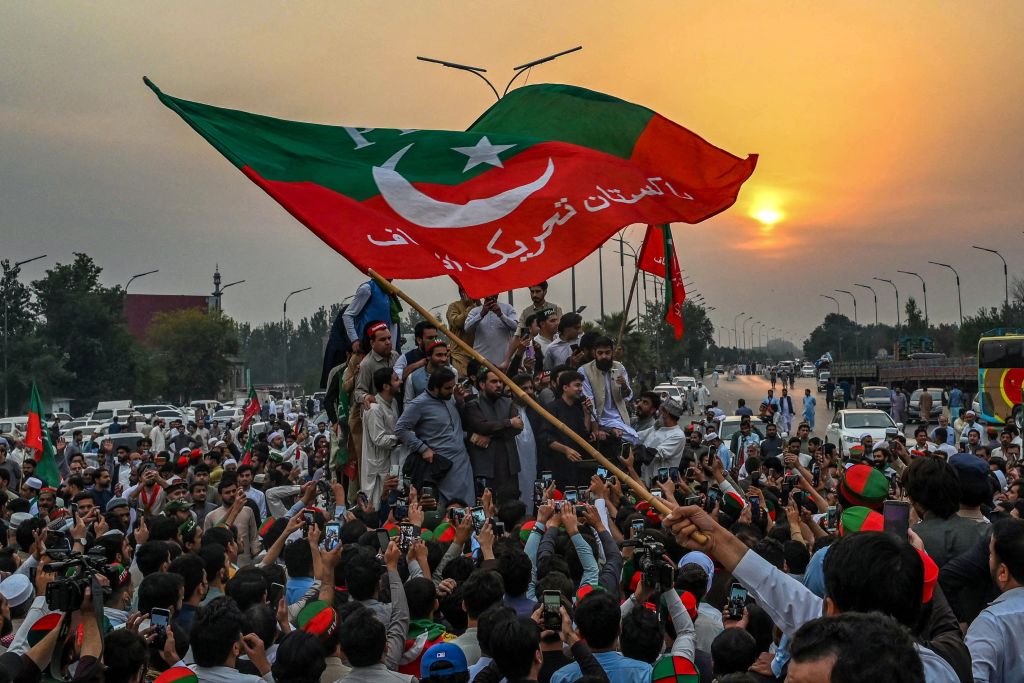 Supporters of former Pakistani Prime Minister Imran Khan take part in a protest as they block the main road a day after the assassination attempt on Khan, in Peshawar on Nov. 4, 2022. (Abdul Majeed—AFP via Getty Images)