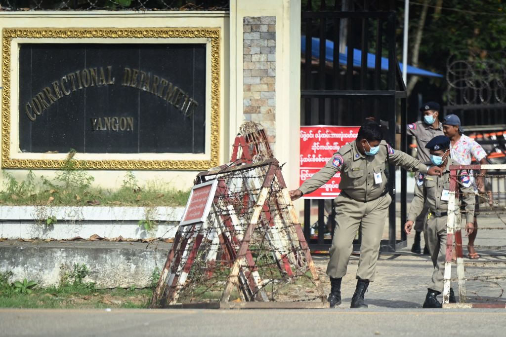 Prison security officials prepare for the release of inmates outside Insein prison in Yangon on Nov. 17, 2022. (AFP/Getty Images)