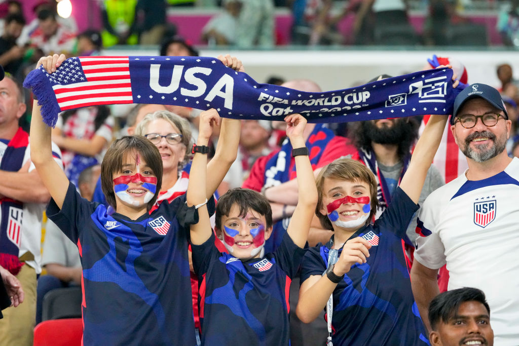Young supporters of the United States men's national soccer team cheer in the stands prior to the World Cup match against Wales at Ahmad Bin Ali Stadium in Doha, Qatar, Nov. 21, 2022. (Ulrik Pedersen—DeFodi Images/Getty Images)