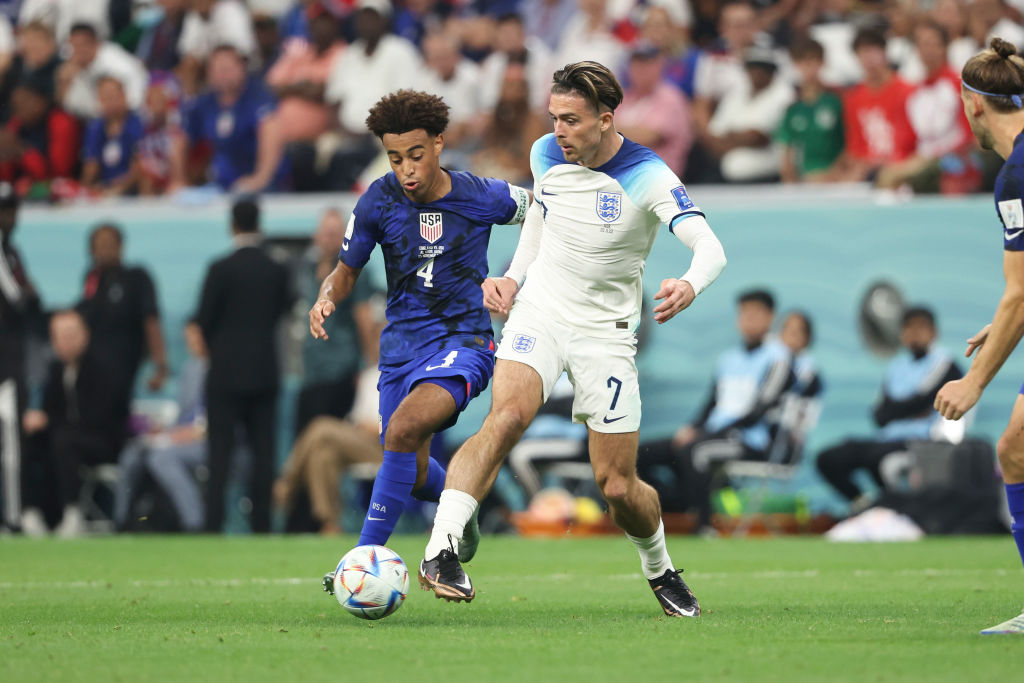 Jack Grealish of England and Tyler Adams of Team USA during the FIFA World Cup Qatar 2022 Group B match on November 25, 2022 in Al Khor, Qatar. (Matthew Ashton-AMA/Getty Images)
