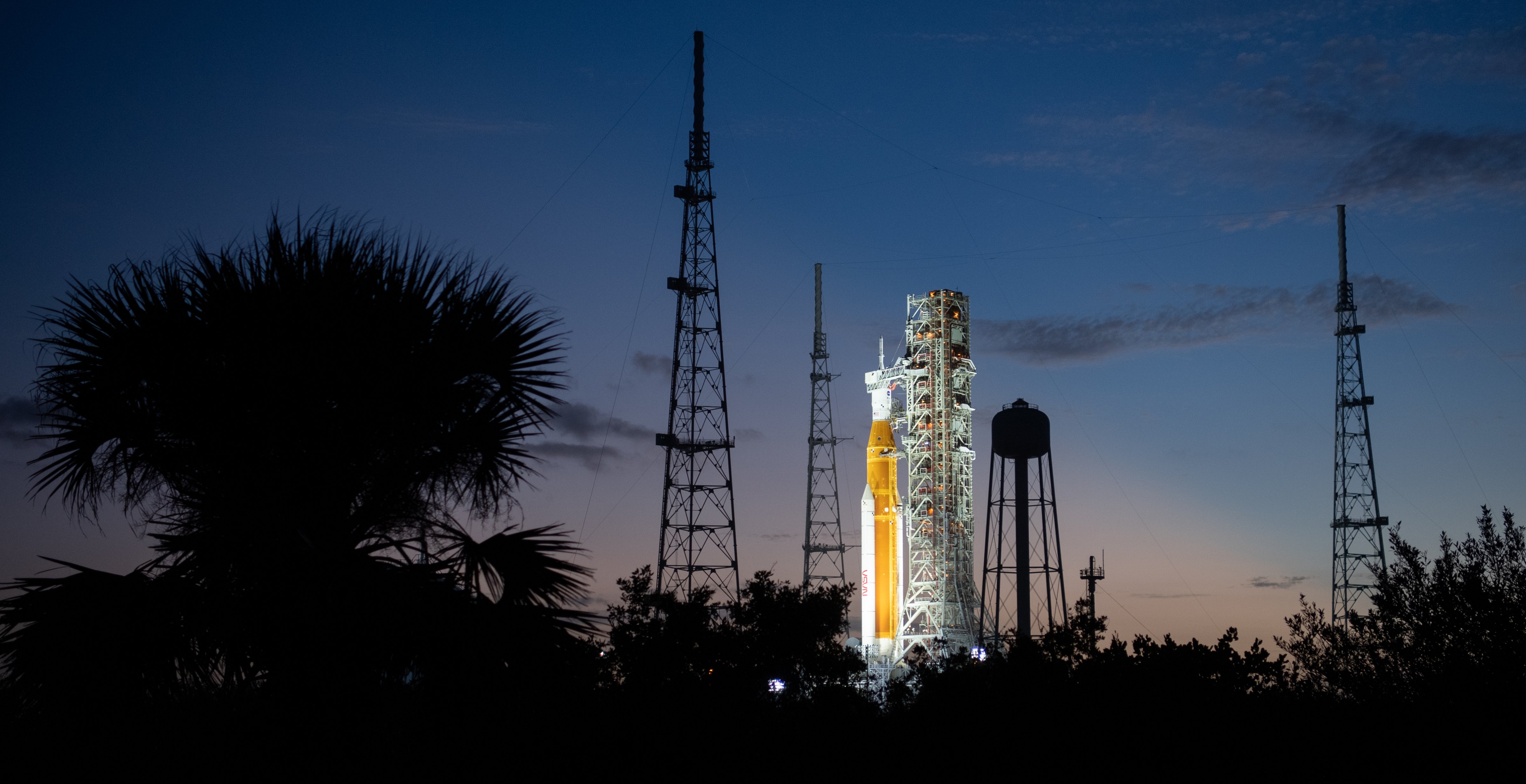 NASA’s Space Launch System (SLS) rocket with the Orion spacecraft aboard is seen illuminated by spotlights after sunset atop the mobile launcher at Launch Pad 39B as preparations for launch continue, Sunday, Nov. 6, 2022, at NASA’s Kennedy Space Center in Florida. (NASA/Joel Kowsky)