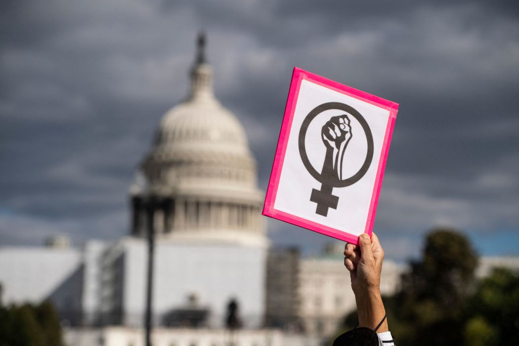 An abortion rights demonstrator holds a sign near the US Capitol during the annual Women's March to support Women's Rights in Washington, DC, on October 8, 2022. (ROBERTO SCHMIDT—AFP/Getty Images)
