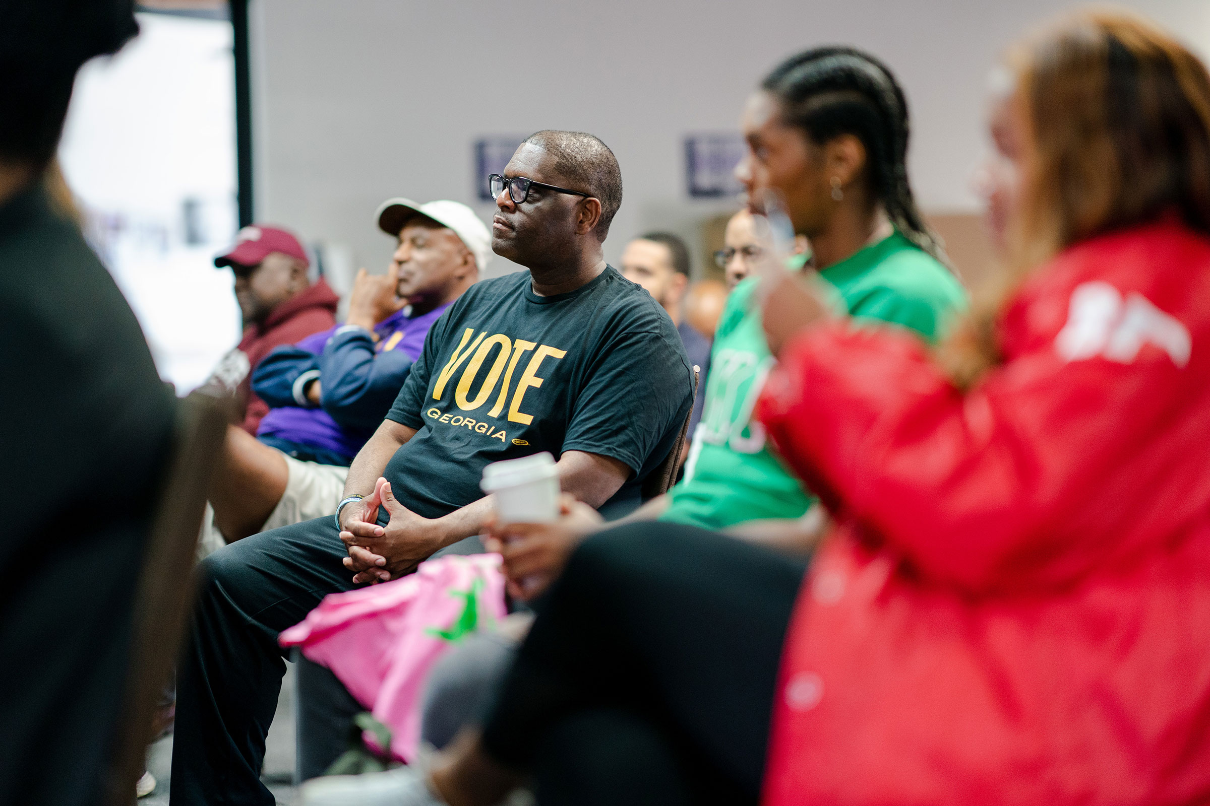 Members of Greek letter organizations listen as Stacey Abrams speaks during Divine 9 Day of Action on Oct. 8, 2022, an event aimed at reaching voters to cast their ballot for her for Georgia governor. (Kevin D. Liles—The Washington Post/Getty Images)