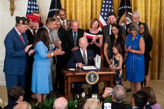 President Joe Biden signs the PACT Act into law at the White House in Washington, D.C., Aug. 10, 2022.
