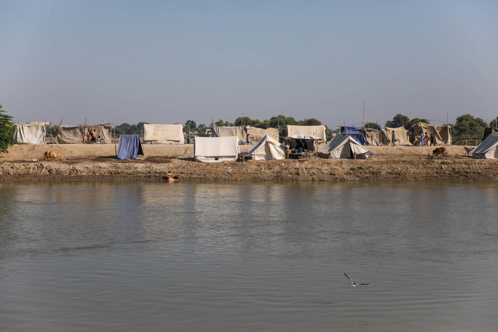 Temporary shelters for people affected by the floods sit on an embankment on Oct. 18, 2022 in Dadu, Pakistan. Nearly one-third of Pakistan was deeply affected by flooding which hit the country in 2022. (Getty Images)