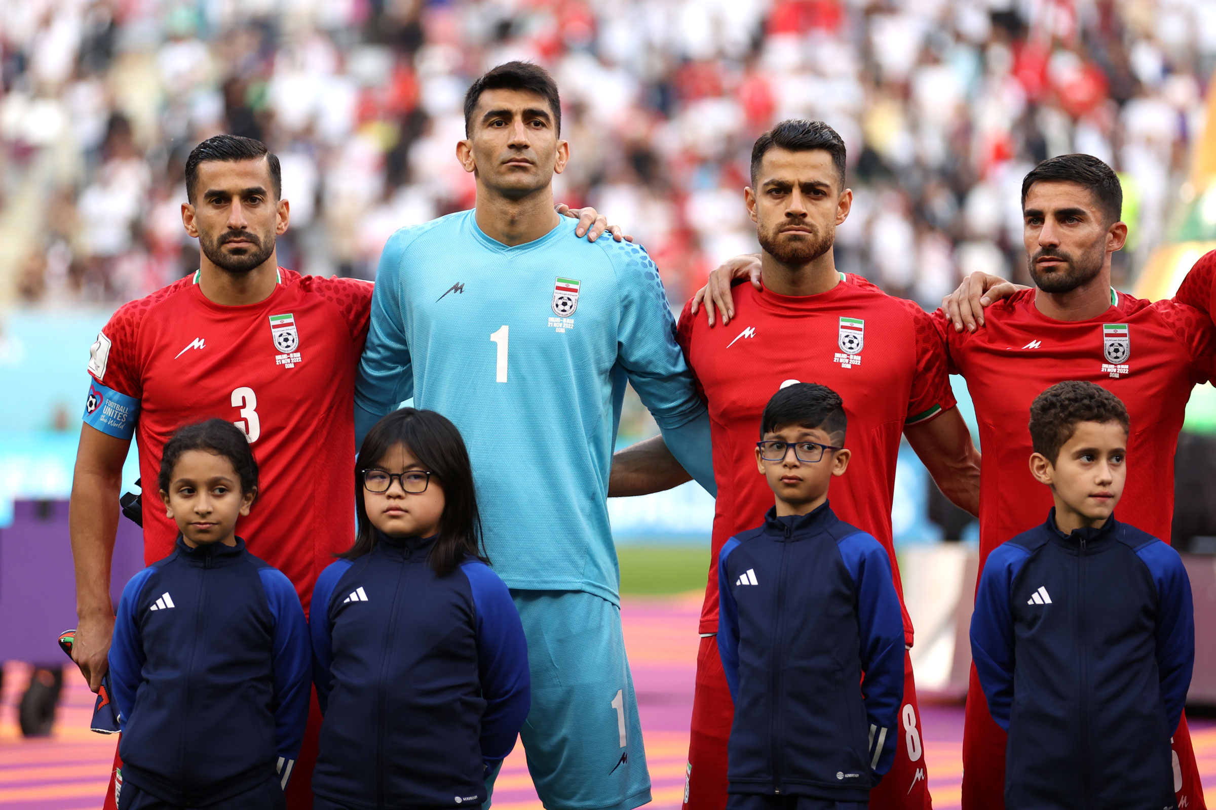 Iranian players line up for the national anthem prior to the match between England and Iran on Nov. 21, 2022 in Doha, Qatar. (Julian Finney—Getty Images)