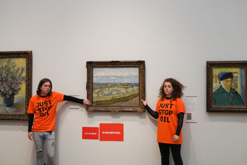 Just Stop Oil climate activists glue themselves to a Van Gogh painting at the Courtauld Gallery on June 30 2022 in London, U.K. The Just Stop Oil activists call for the government to end new oil and gas and for art institutions to join them in civil resistance. (Kristian Buus/In Pictures—Getty Images)