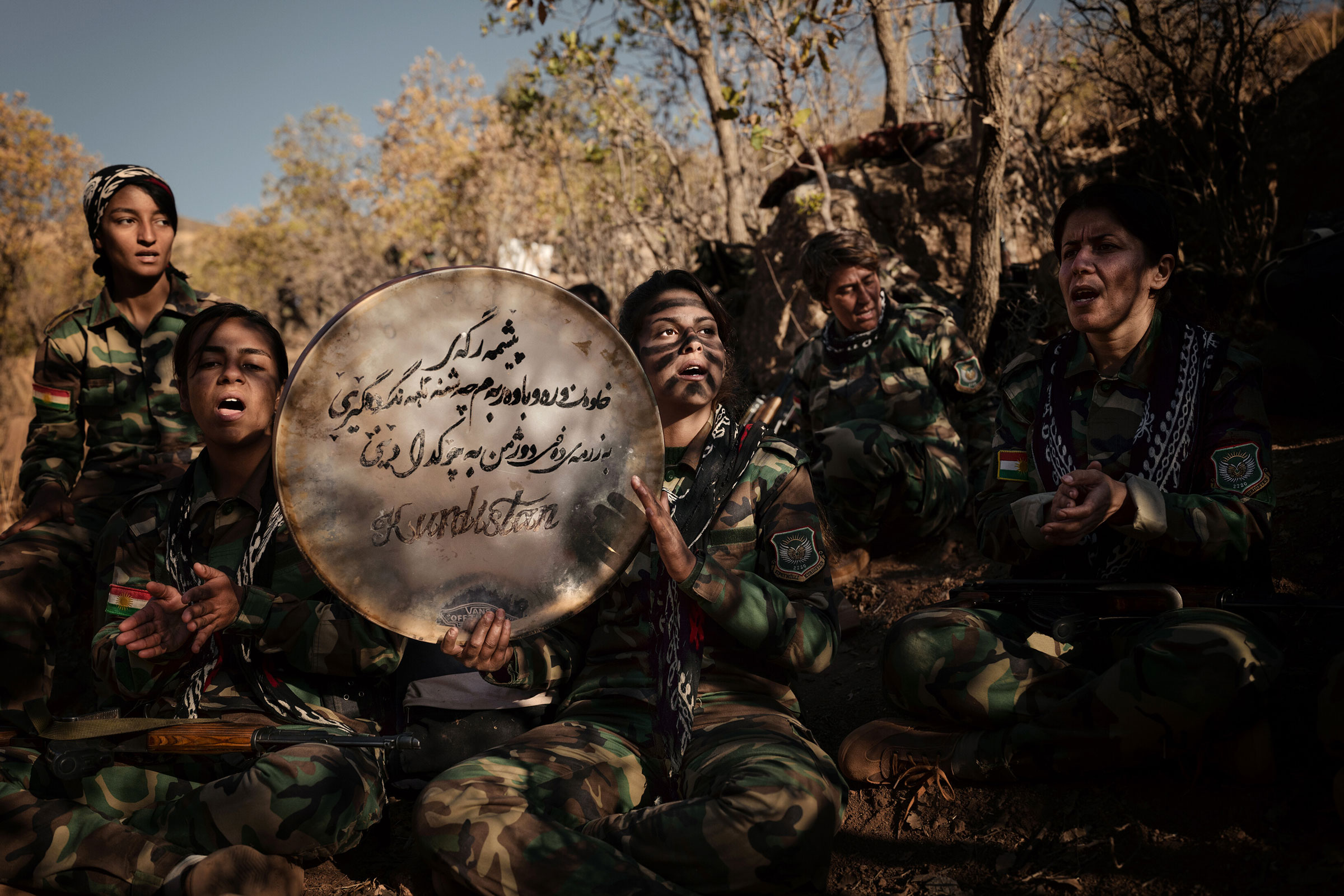 Female members of the Iranian opposition group Kurdistan Freedom Party (P.A.K.) sing protest songs in the Kurdistan Region of Iraq, on Nov. 15, 2022. (Emily Garthwaite—The New York Times/Redux)