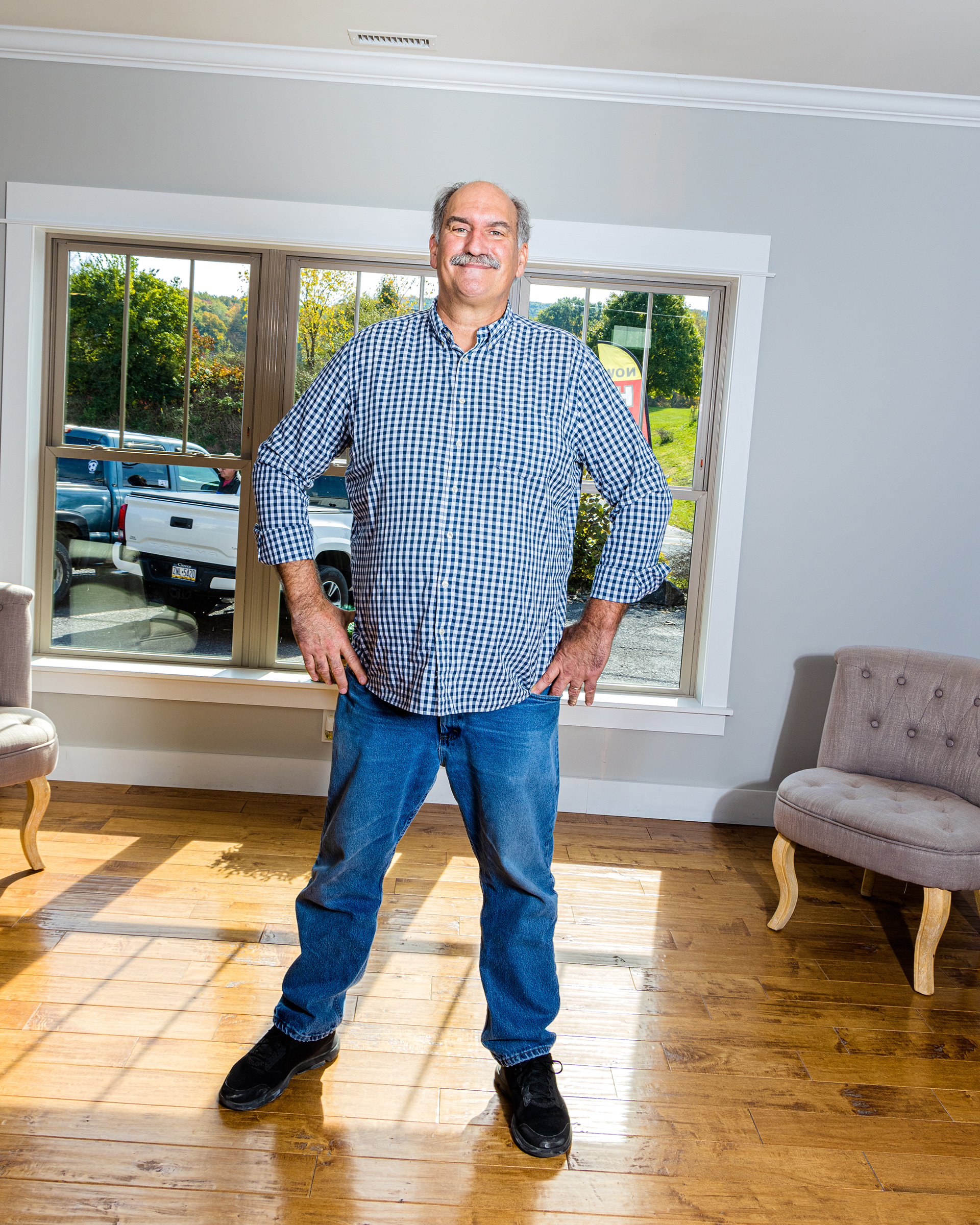 Ken Semler stands in an Apex spec home on the factory property. (Evan Angelastro for TIME)