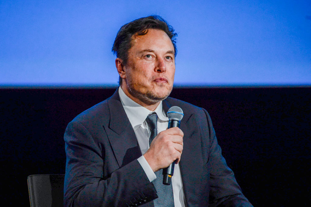Tesla CEO Elon Musk looks up as he addresses guests at the Offshore Northern Seas 2022 (ONS) meeting in Stavanger, Norway on August 29, 2022. (Carina Johansen/NTB/AFP—Getty Images)