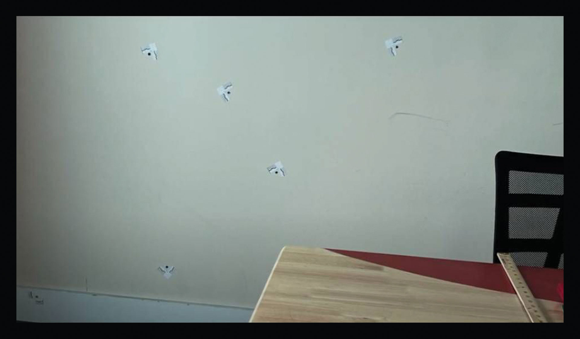 A still from Craig Greenberg's campaign ad showing six bullet holes after an attack on his campaign office on Feb. 14, 2022. (Greenberg for Mayor)
