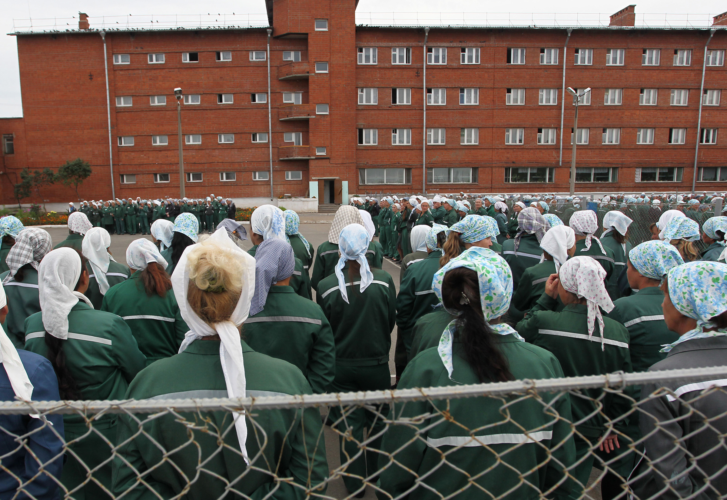 Imprisoned women stand during a morning inspection at a women's prison in a town of Sarapul, central Russia, in August 2012. (Yuri Tutov—AP)