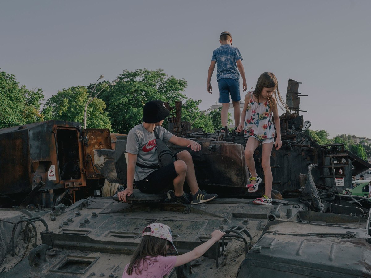 Children play on destroyed Russian war equipment in front of St. Michaelâ€˜s Monastery in Kyiv on June 12.