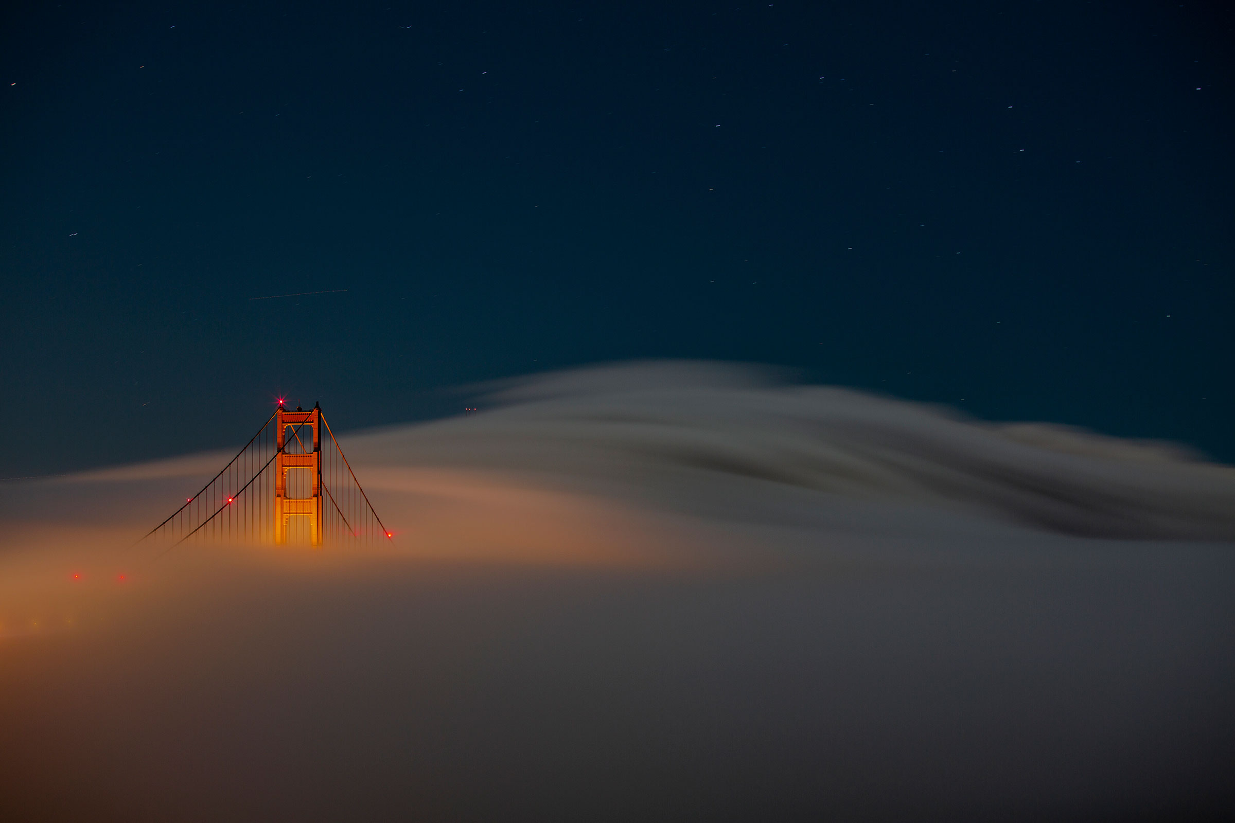 Fog rolls through the Marin Headlands and Golden Gate Bridge in Sausalito, Calif., on June 11. (Nina Riggio—The New York Times/Redux)
