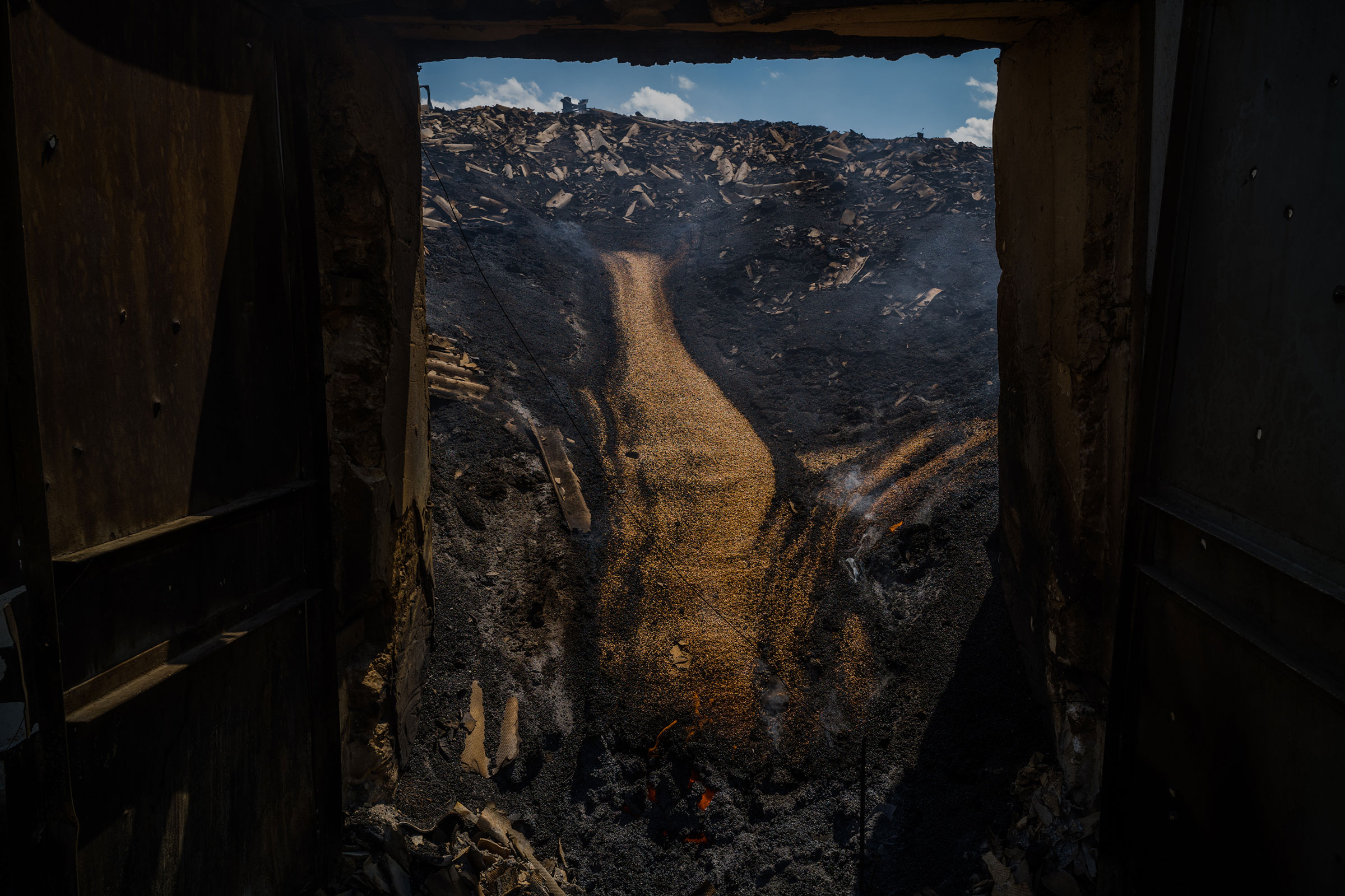 A bombed grain silo containing still burning grain inside in Zasillya, Ukraine, on July 16. (Wojciech Grzedzinski—The Washington Post/Getty Images)