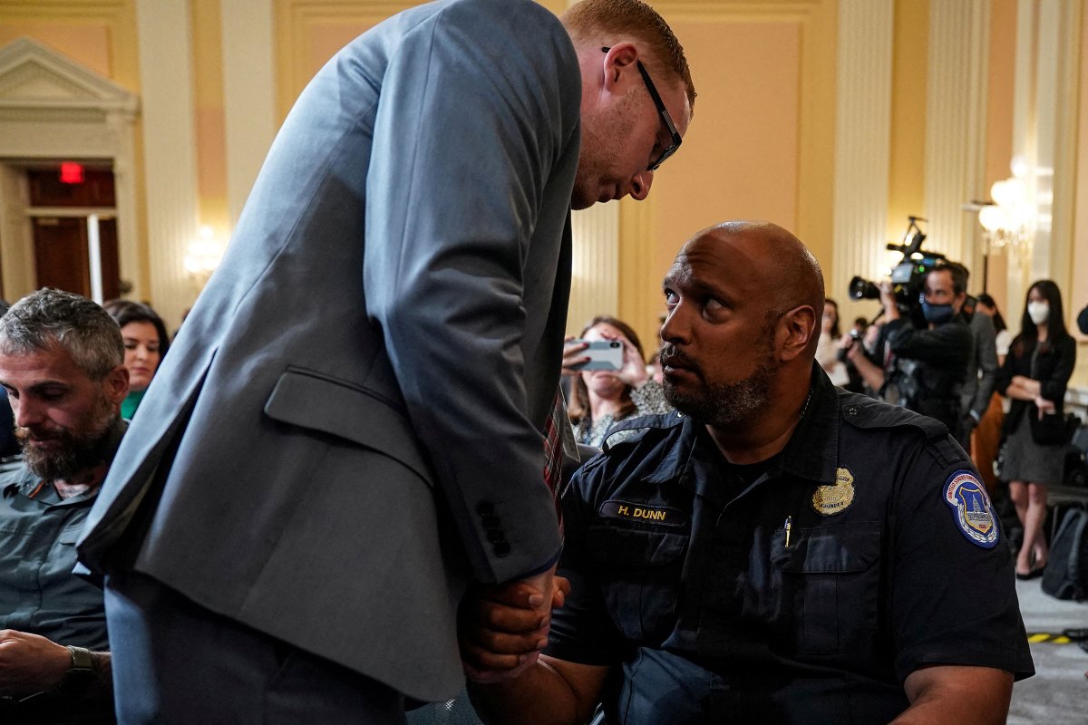 Stephen Ayres, January 6 rioter, speaks to Harry Dunn, U.S. Capitol Police officer, following testimony before the House Select Committee to investigate the January 6 Attack on the U.S. Capitol, in Washington, on July 12.