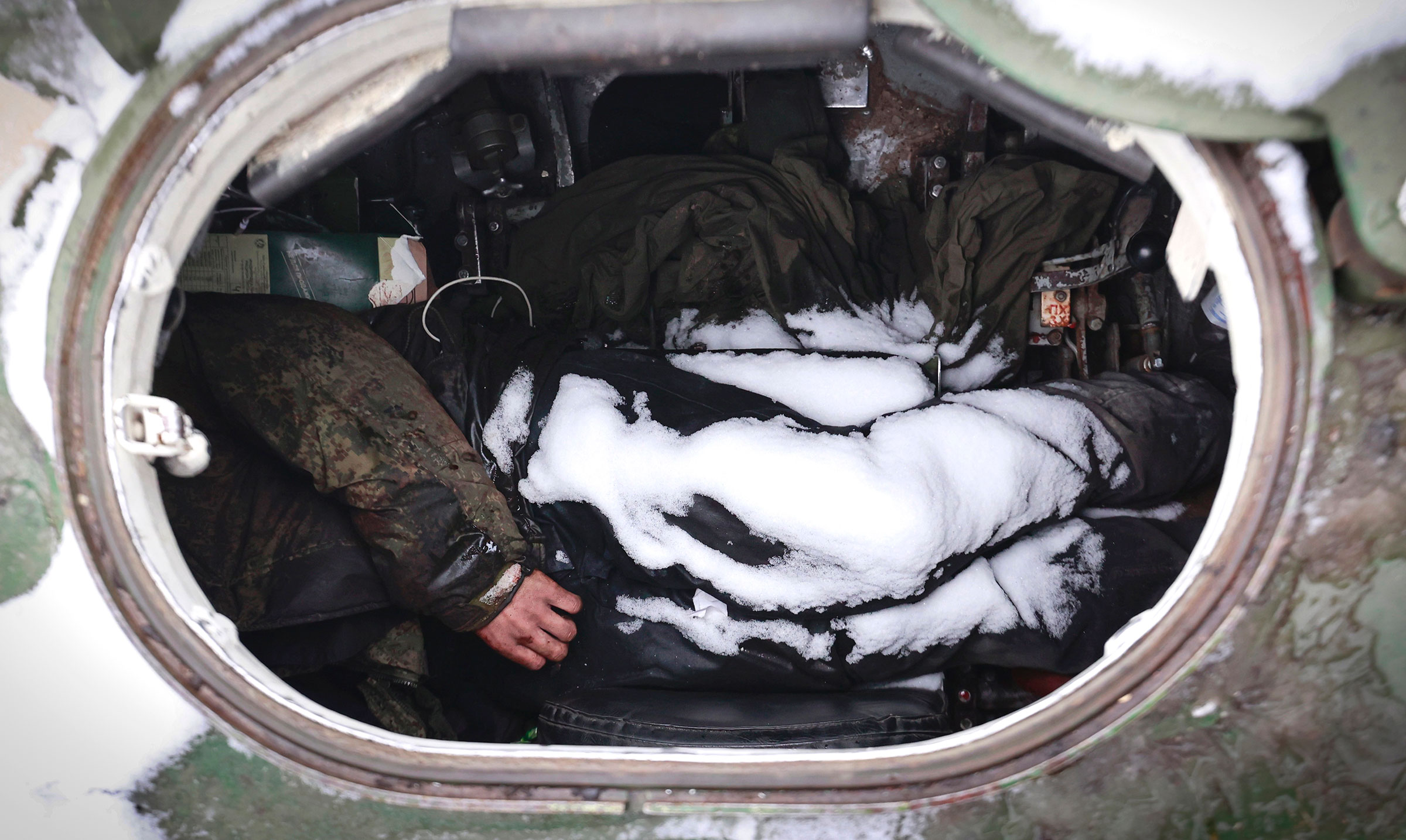 The dead bodies of soldiers are seen in a military vehicle on a road in the town of Bucha, close to the capital Kyiv, Ukraine, on March 1. (Serhii Nuzhnenko—AP)