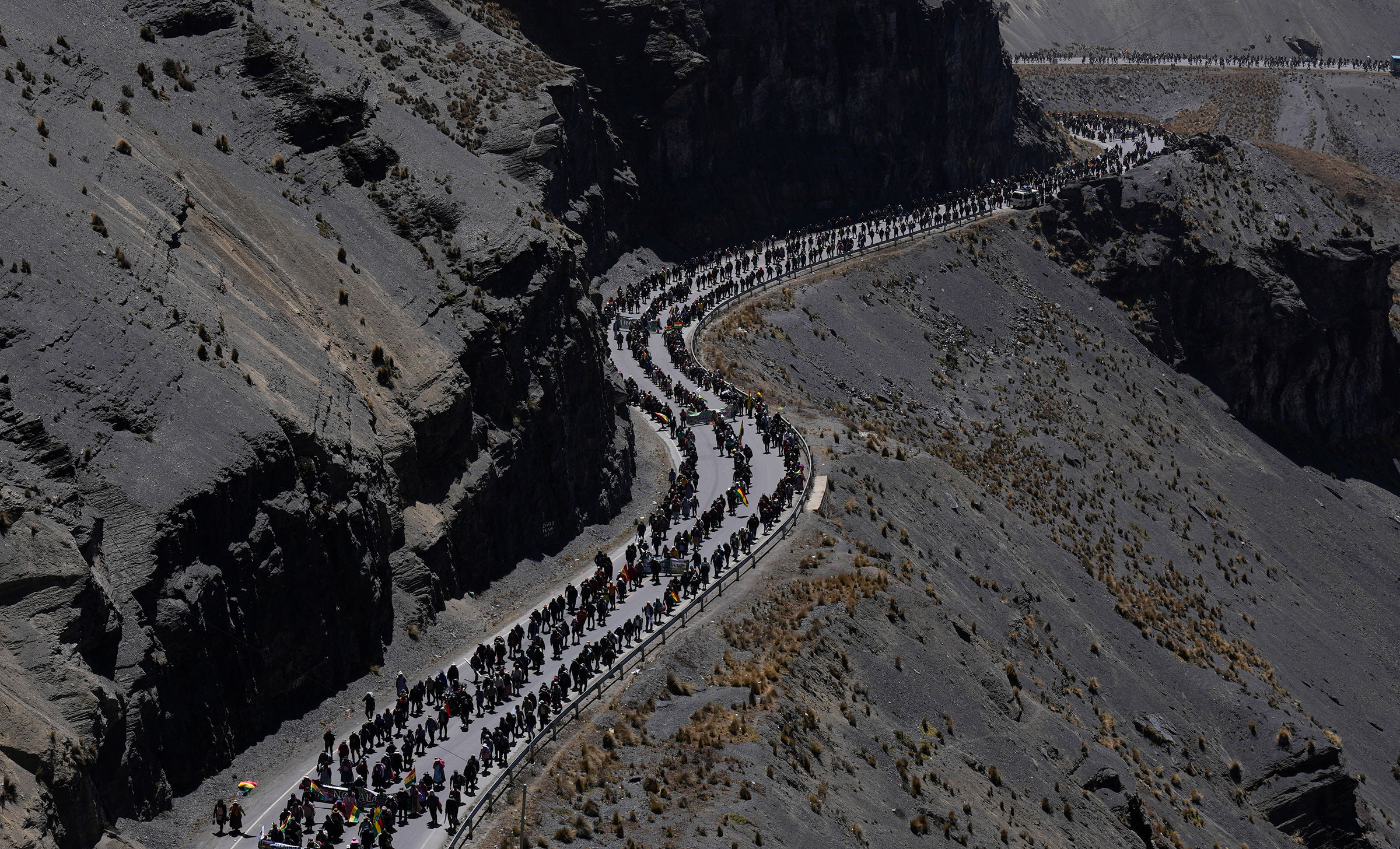 Anti-government coca farmers walk towards the capital, marching to demand the closure of a parallel market that is promoted by a group related to the government, on the outskirts of La Paz, Bolivia, on Sept. 7. (Juan Karita—AP)