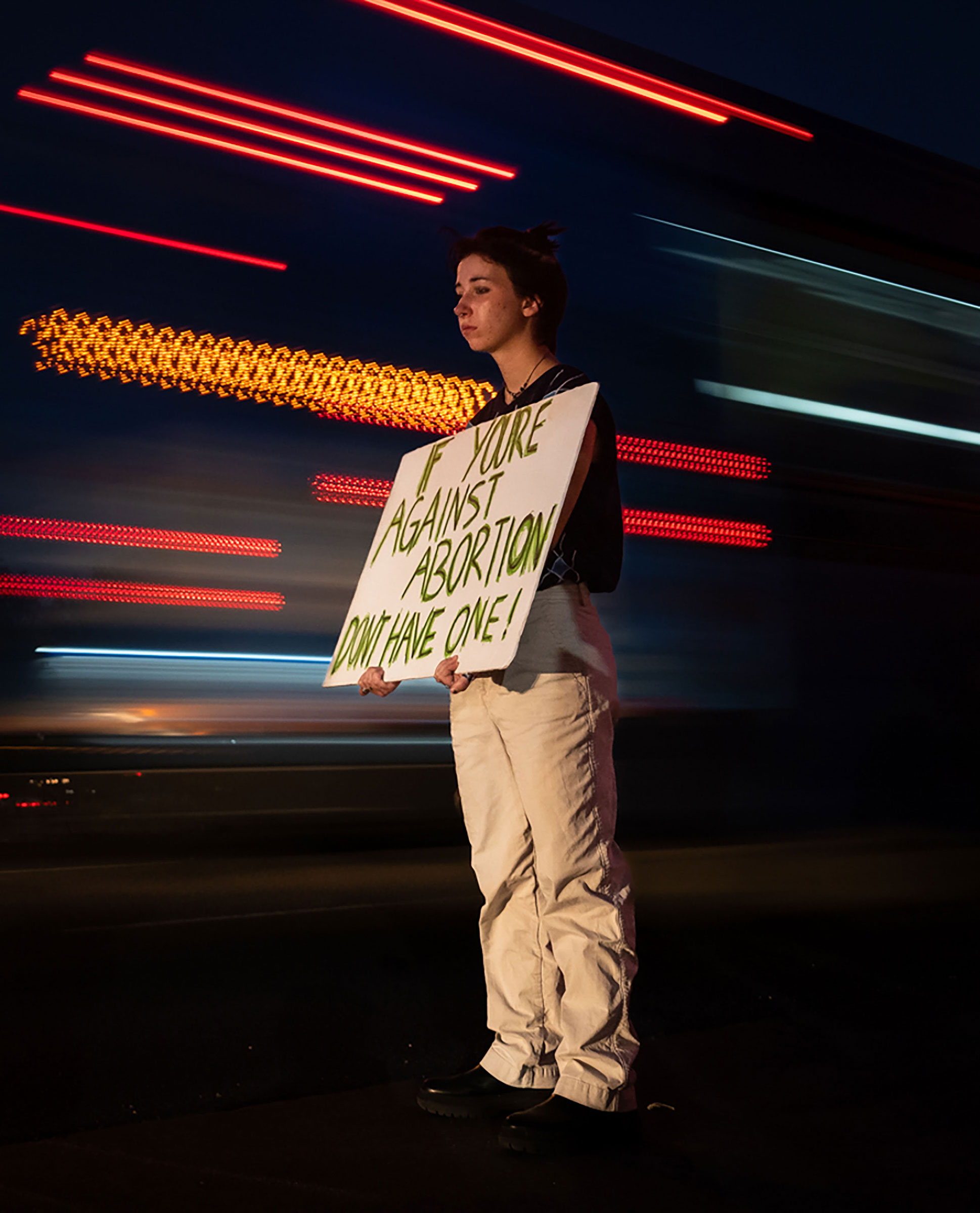 Cullen Savory, 19, holds a sign up to passing traffic at an International Safe Abortion Day Vigil for Legal Abortion in front of Planned Parenthood on East Ben White Boulevard in Austin, on Sept. 28.