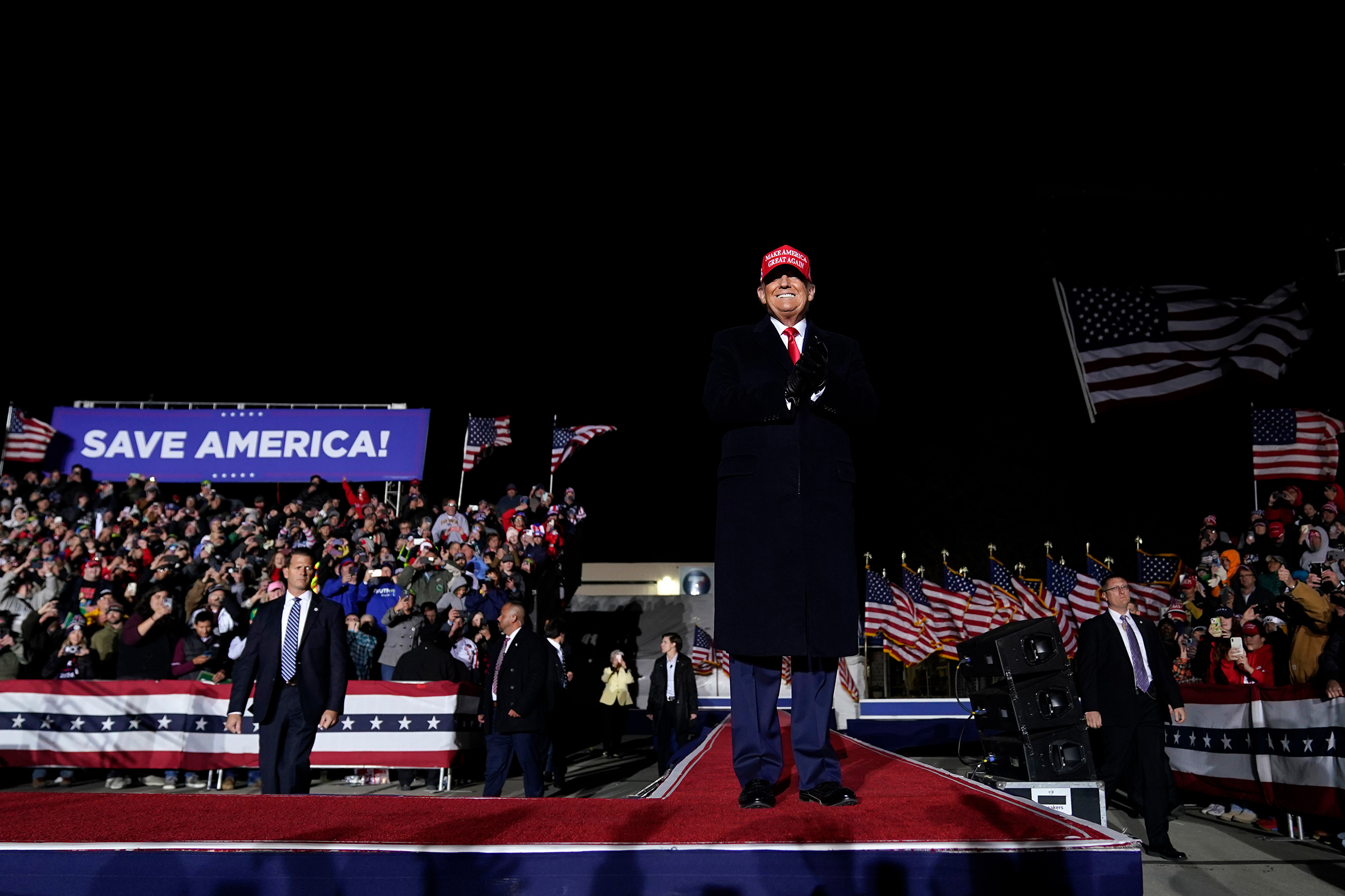 Former President Donald Trump arrives to speak at a rally in Sioux City, Iowa, Nov. 3, 2022. (Charlie Neibergall—AP)
