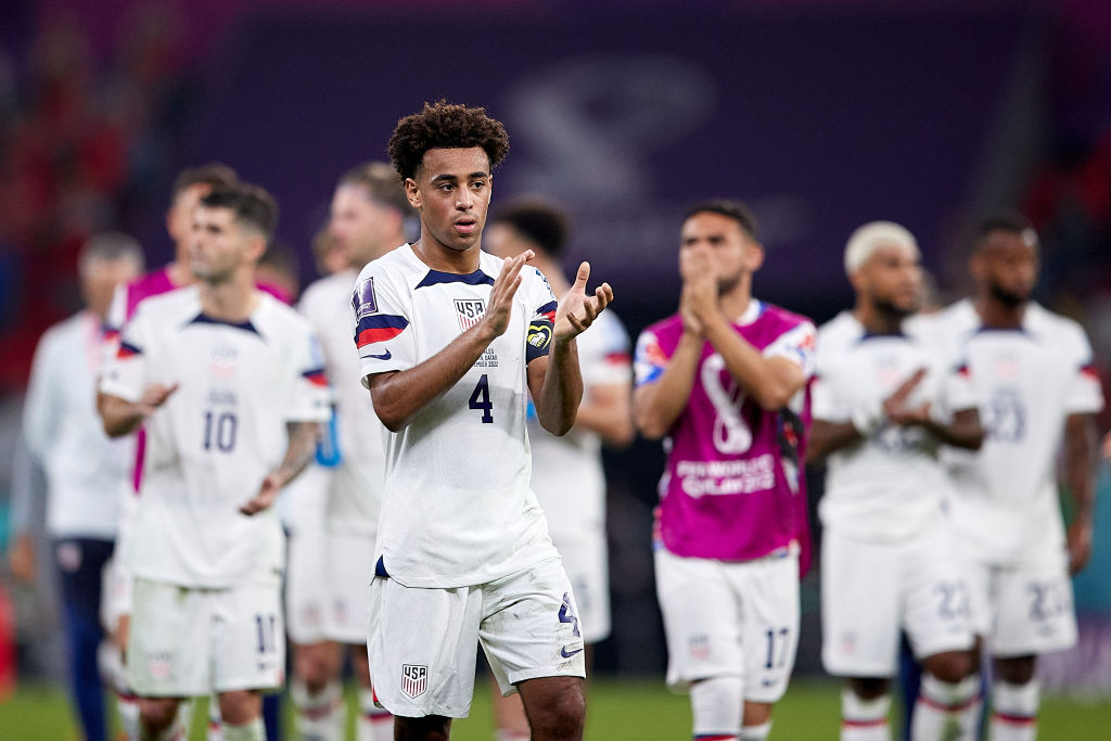 Tyler Adams shows appreciation to the fans at the end of the FIFA World Cup Qatar 2022 match between USA and Wales on November 21, 2022 in Doha, Qatar. ((Juan Luis Diaz—Quality Sport Images/Getty Images))