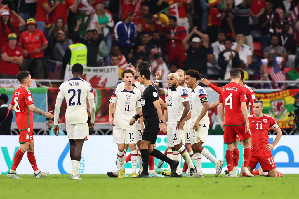 Tyler Adams and Brendan Aronson of the United States are among the players appealing the decision by referee Abdulrahman Al Jassim of Qatar to award a penalty to Wales for an infringement on November 21, 2022. (Youssef Lulidi—Fantasista/Getty Images)