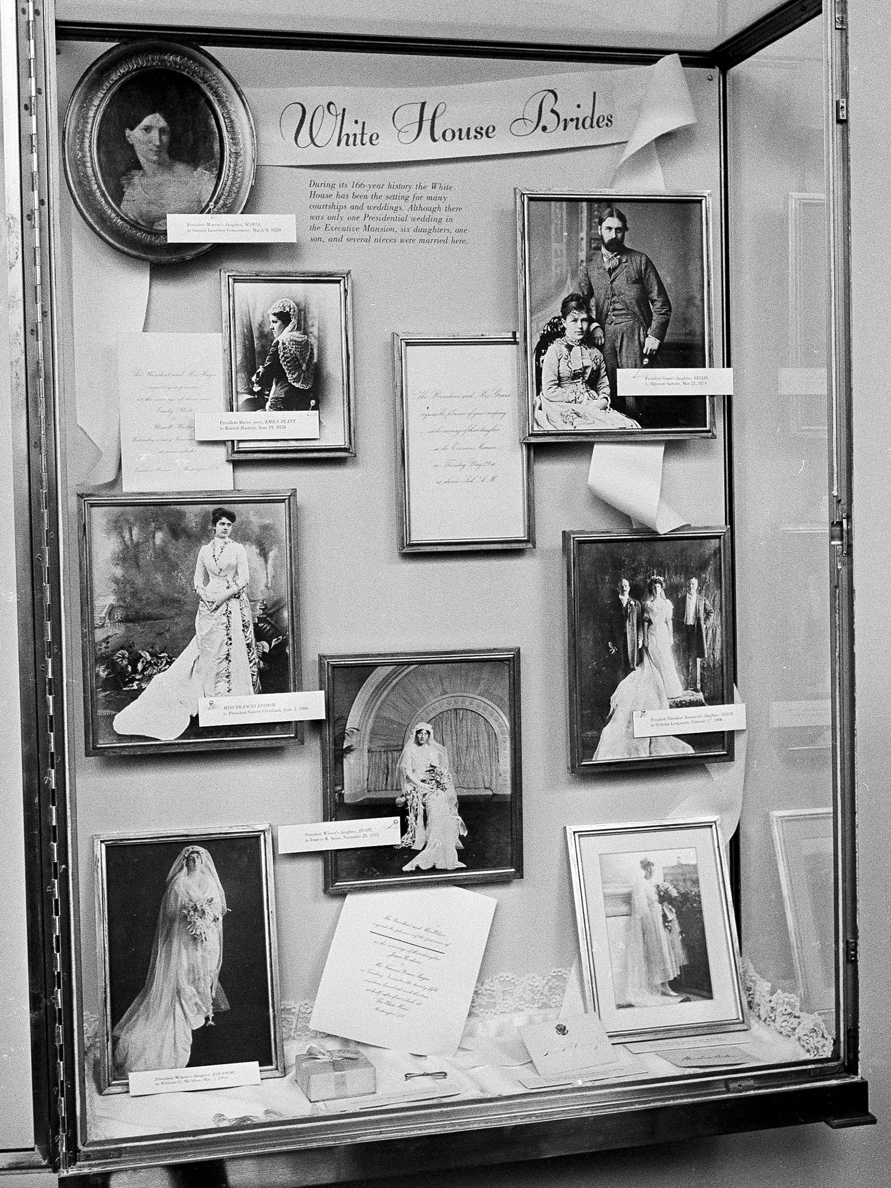 Photographs of brides married in the White House are displayed in the executive mansion in a glass-enclosed case in Washington, Aug. 1, 1966. Down the left side of the frame, top the bottom, are: President James Monroe's daughter, Maria; President Rutherford B. Haye's niece, Emily Platt, Miss Frances Folsom, married to President Grover Cleveland; and President Woodrow Wilson's daughter, Eleanor. At center, President Wilson's daughter, Jessie. At right, top to bottom: President U.S. grant's daughter, Nellie; President Theodore Roosevelt's daughter, Alice; and President Wilson's niece, Alice Wilson. (AP)