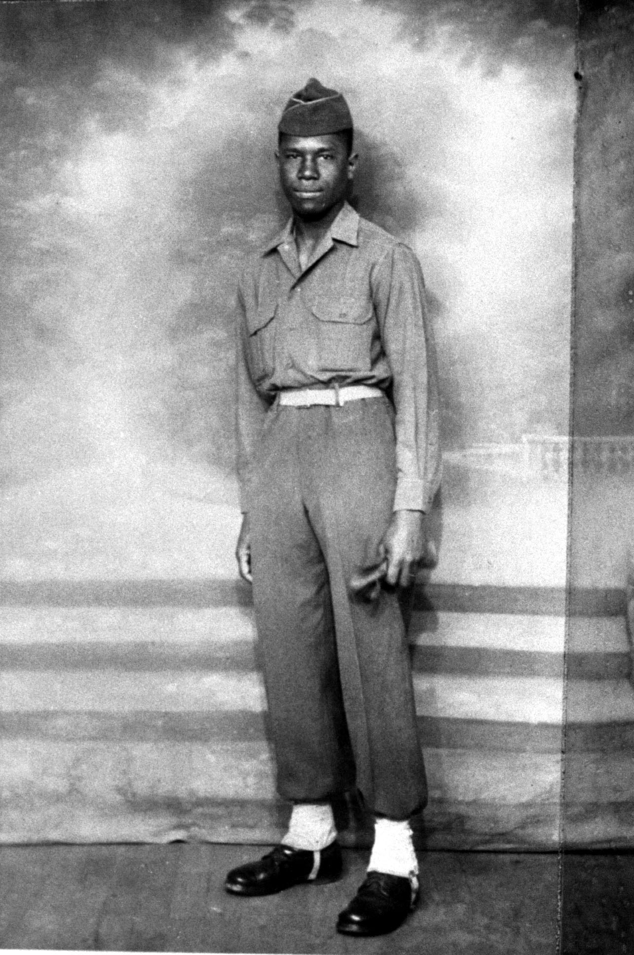 Future civil rights leader Medgar Evers posing in his army uniform in Charbourg, France, in 1945.
