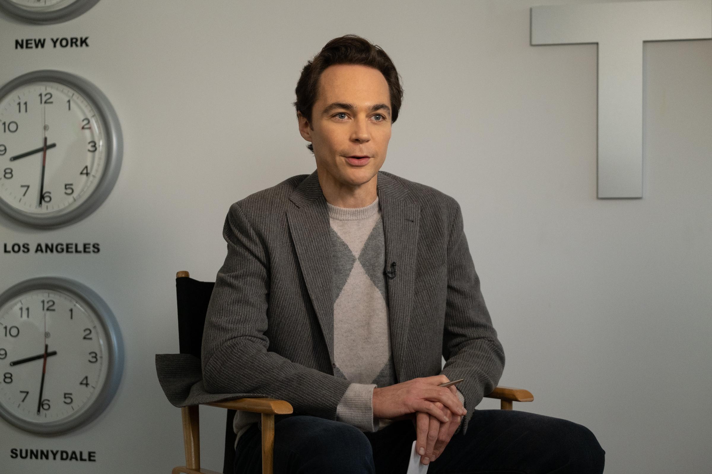 Jim Parsons sitting in a chair, as Michael