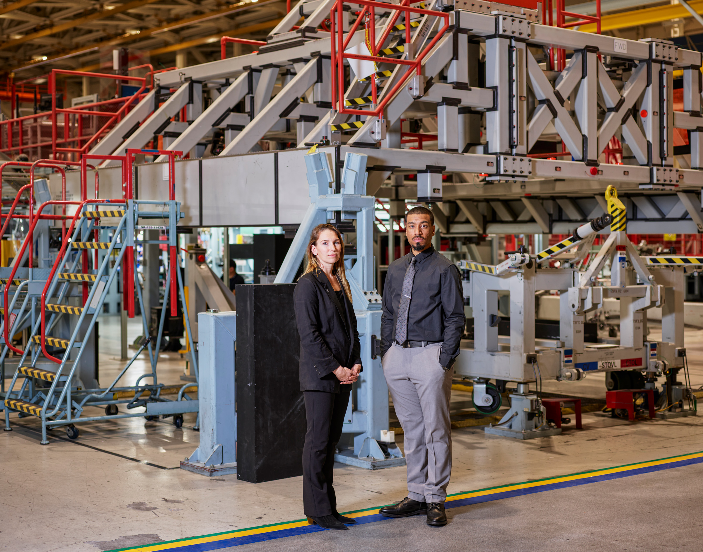 Jessi Ross, a program director, and Hassan Charles, a surface technician, are among 5,000 employees at Northrop Grumman now working on the B-21 bomber. (Christopher Payne for TIME | A small portion of this image was removed for security purposes.)