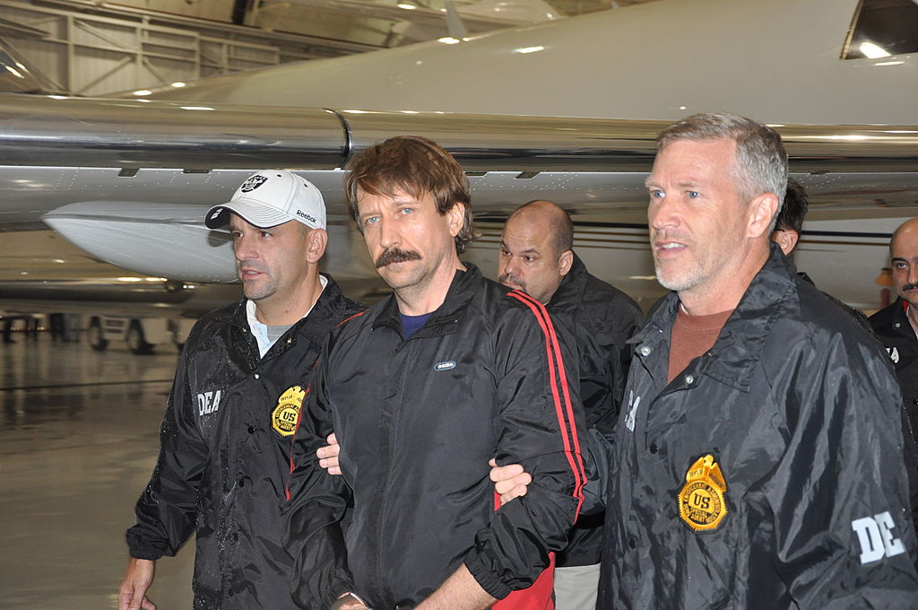 In this photo provided by the U.S. Department of Justice, former Soviet military officer and arms trafficking suspect Viktor Bout (C) deplanes after arriving at Westchester County Airport November 16, 2010 in White Plains, New York. Bout was extradited from Thailand to the U.S. to face terrorism charges. (U.S. Department of Justice/Getty Images)