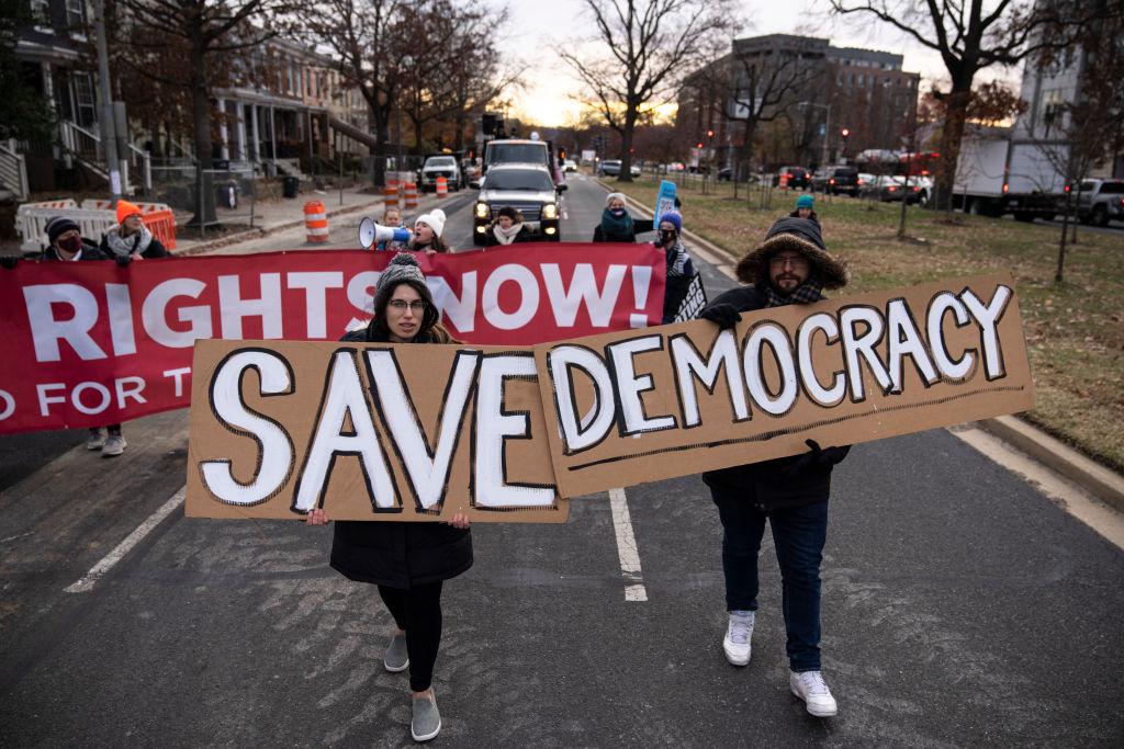 Activists rally for voting rights and DC statehood as they block traffic on Pennsylvania Avenue SE on December 7, 2021 in Washington, DC. (Drew Angerer—Getty Images)