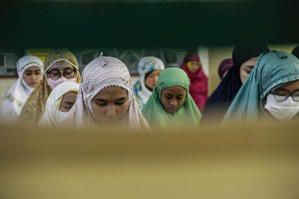 Indonesian Muslim women perform the first 'Tarawih' prayer on the eve of the Islamic holy month of Ramadan at The Grand Mosque of Bandung on April 2, 2022. (Algi Febri Sugita—SOPA/LightRocket/Getty Images)