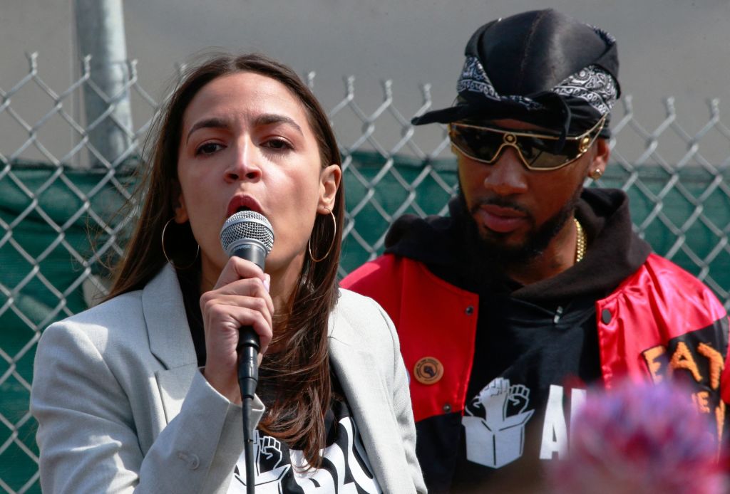 Rep. Alexandria Ocasio-Cortez (D-NY) speaks alongside union organizer Chris Smalls at a rally outside an Amazon facility in Staten Island, New York City, on April 24, 2022. (Kena Betancur—AFP via Getty Images)