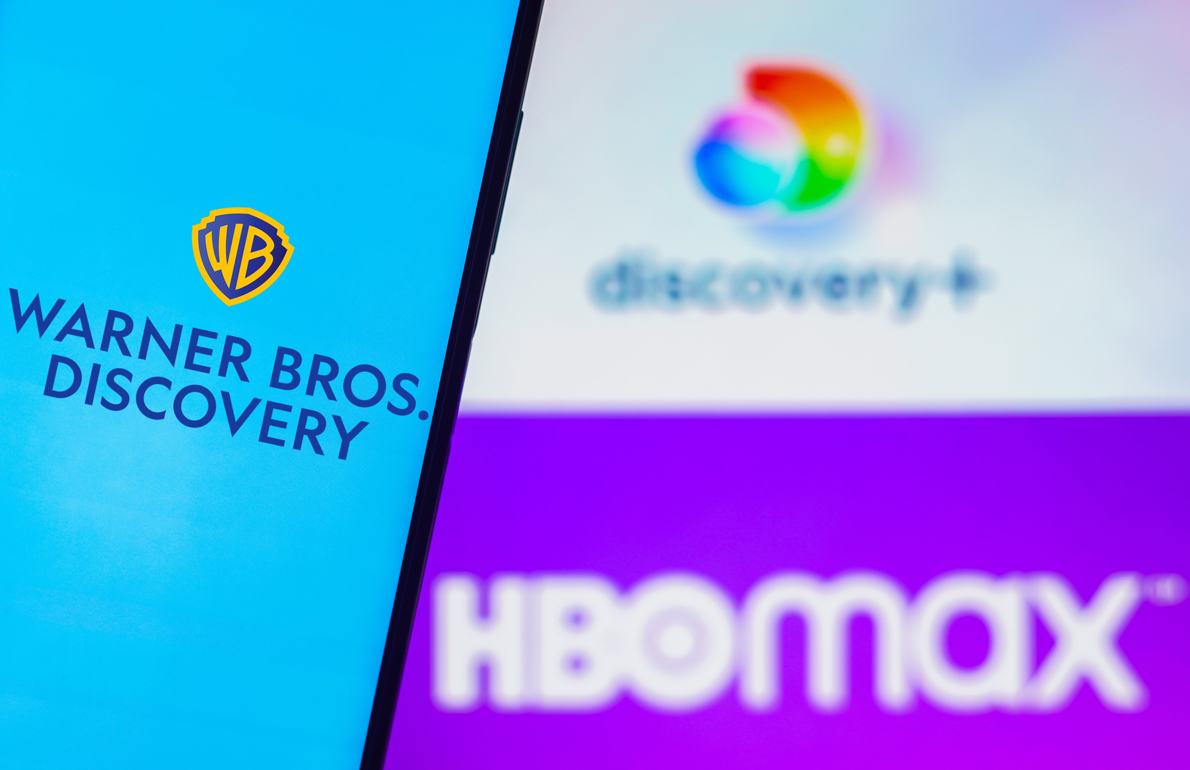 Logos for Warner Bros Discovery, HBO Max, and Discovery+ (Photo Illustration by Rafael Henrique/SOPA Images/LightRocket via Getty Images)