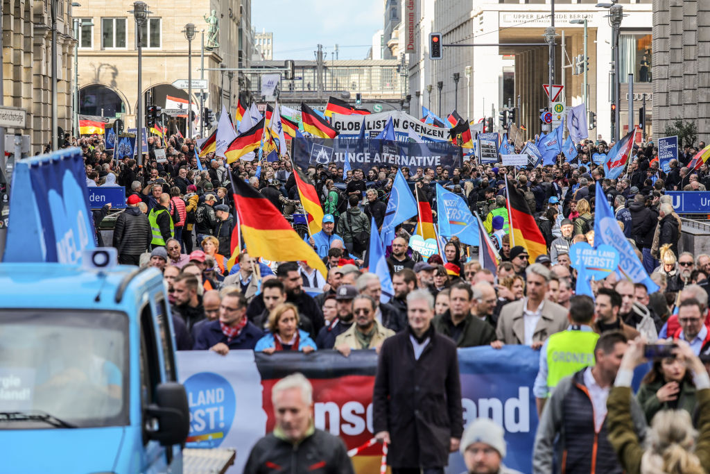 People march to protest against the rising cost of living in a demonstration organized by the right-wing Alternative for Germany (AfD) on Oct. 8, 2022 in Berlin, Germany. (Omer Messinger—Getty Images)