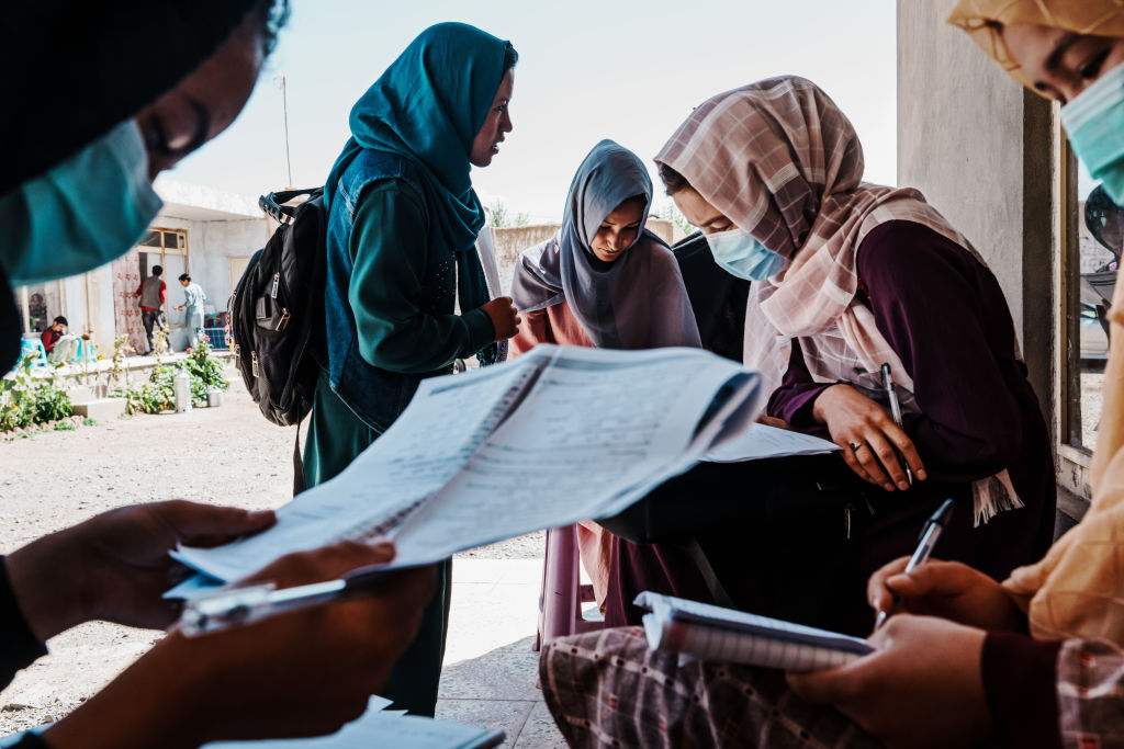 Meena Ibrahimi, 20, center, and other students are preparing and studying for the Kankor exam at a private tutoring center in Bamyan, Afghanistan, Friday, Sept. 23, 2022.
