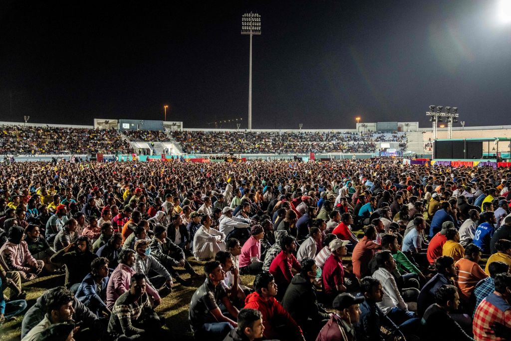 Spectators watch the World Cup match between Brazil and Switzerland, Group G, on a big screen on the outskirts of Doha, Qatar, on November 28, 2022. (Mads Claus Rasmussen—Ritzau Scanpix/AFP via Getty Images)